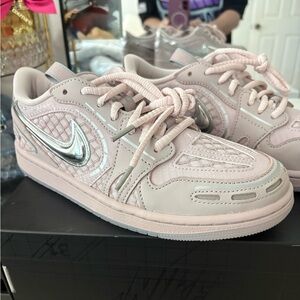 Nike Low-Top Sneakers in Light Pink with Metallic Silver Swoosh